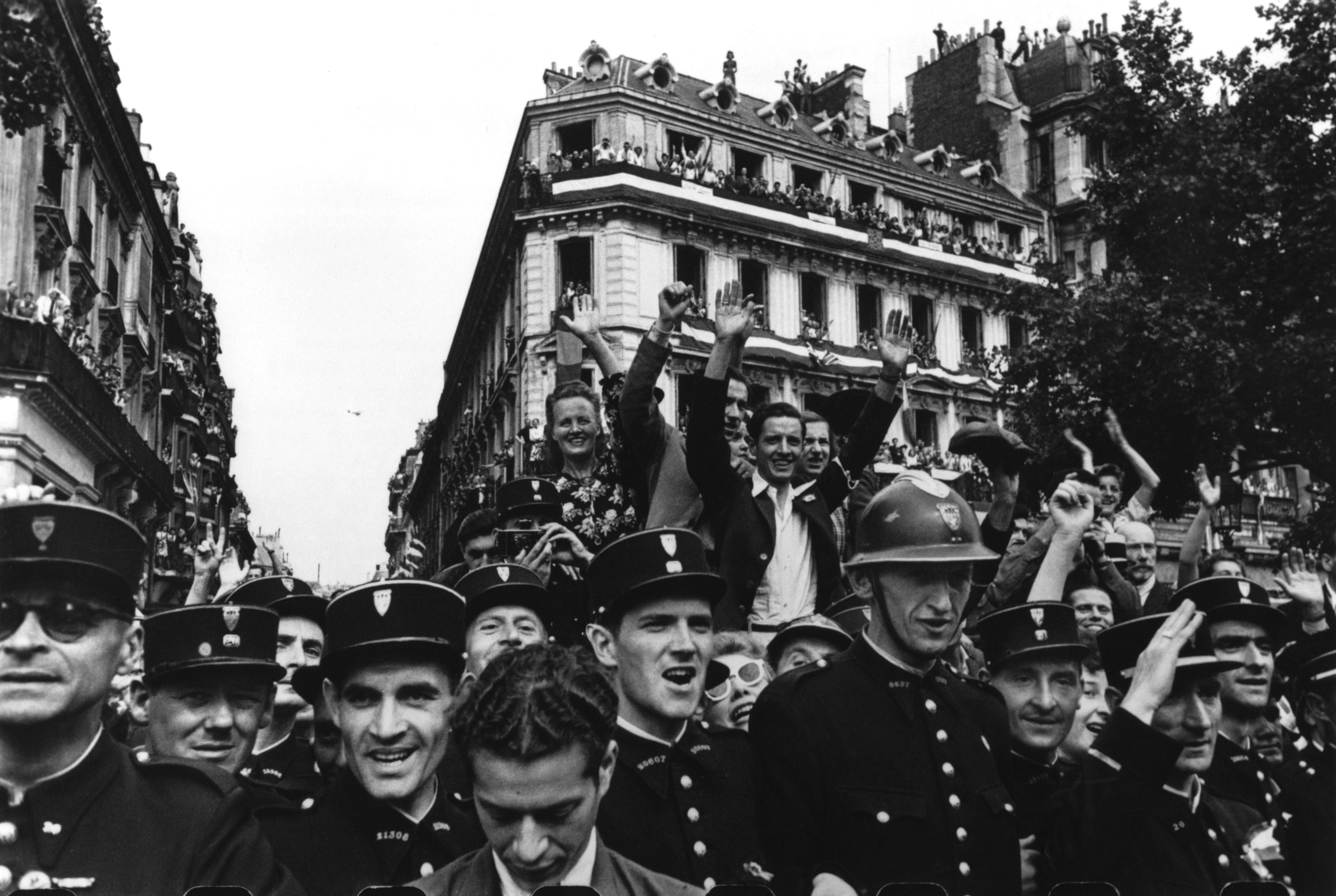 Fine Print: Crowds fill up the Champs Elysees to celebrate the liberation of Paris. Paris, France, August 26th, 1944