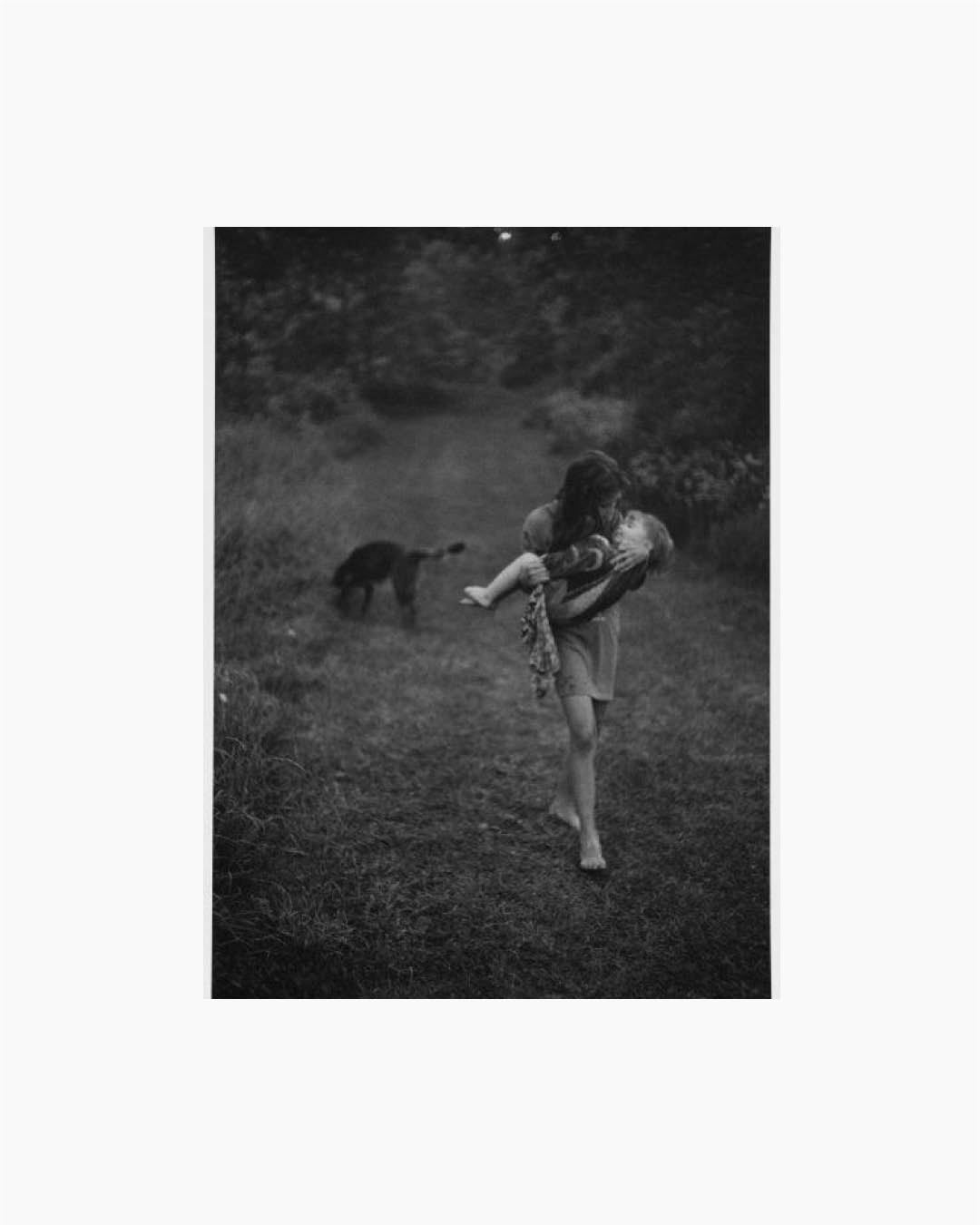 Fine Print: Naomi Towell carries her two-year-old brother home after swimming with him in the river rapids. Lambton County, Ontario, Canada, 1996