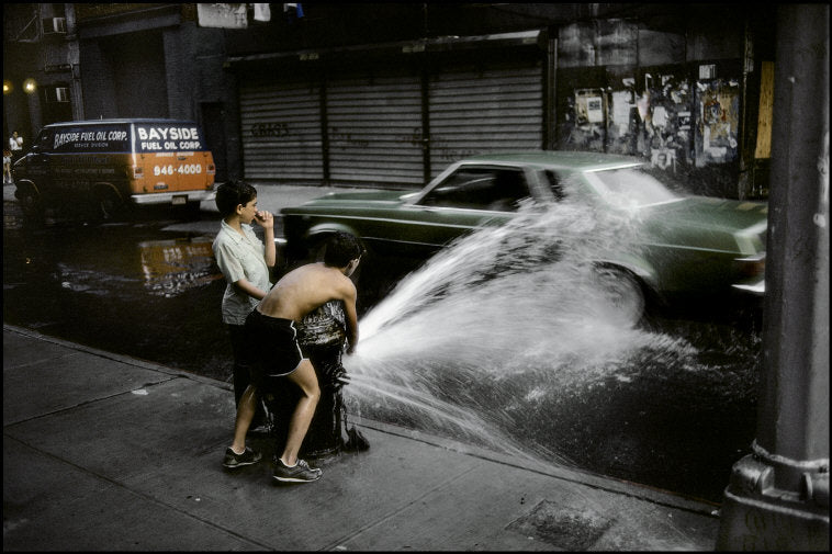 Children playing with Fire hydrant. New York City, USA, 1985