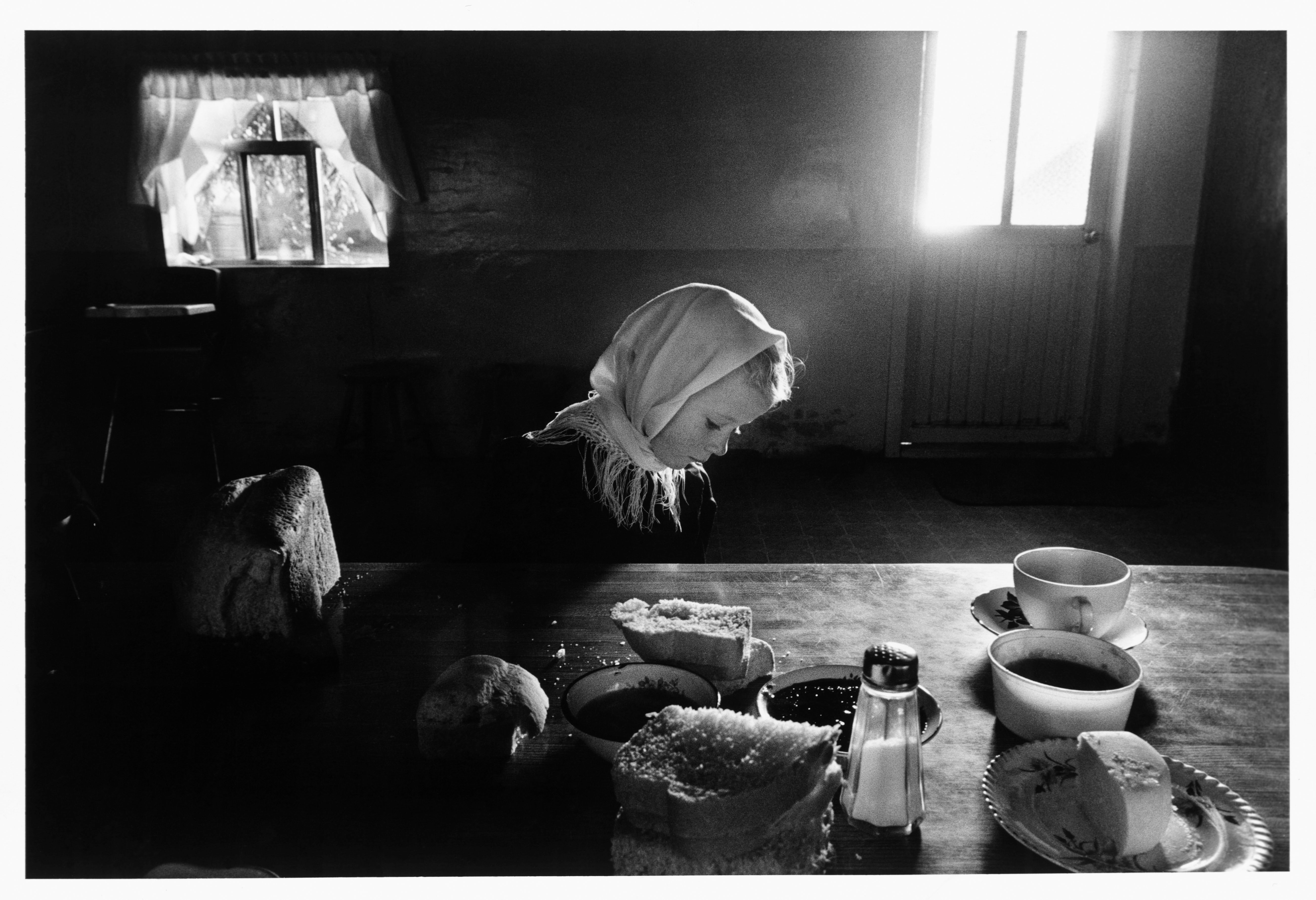 Fine Print: Mennonite girl sitting at a table. La Batea, Zacatecas, Mexico, 1992