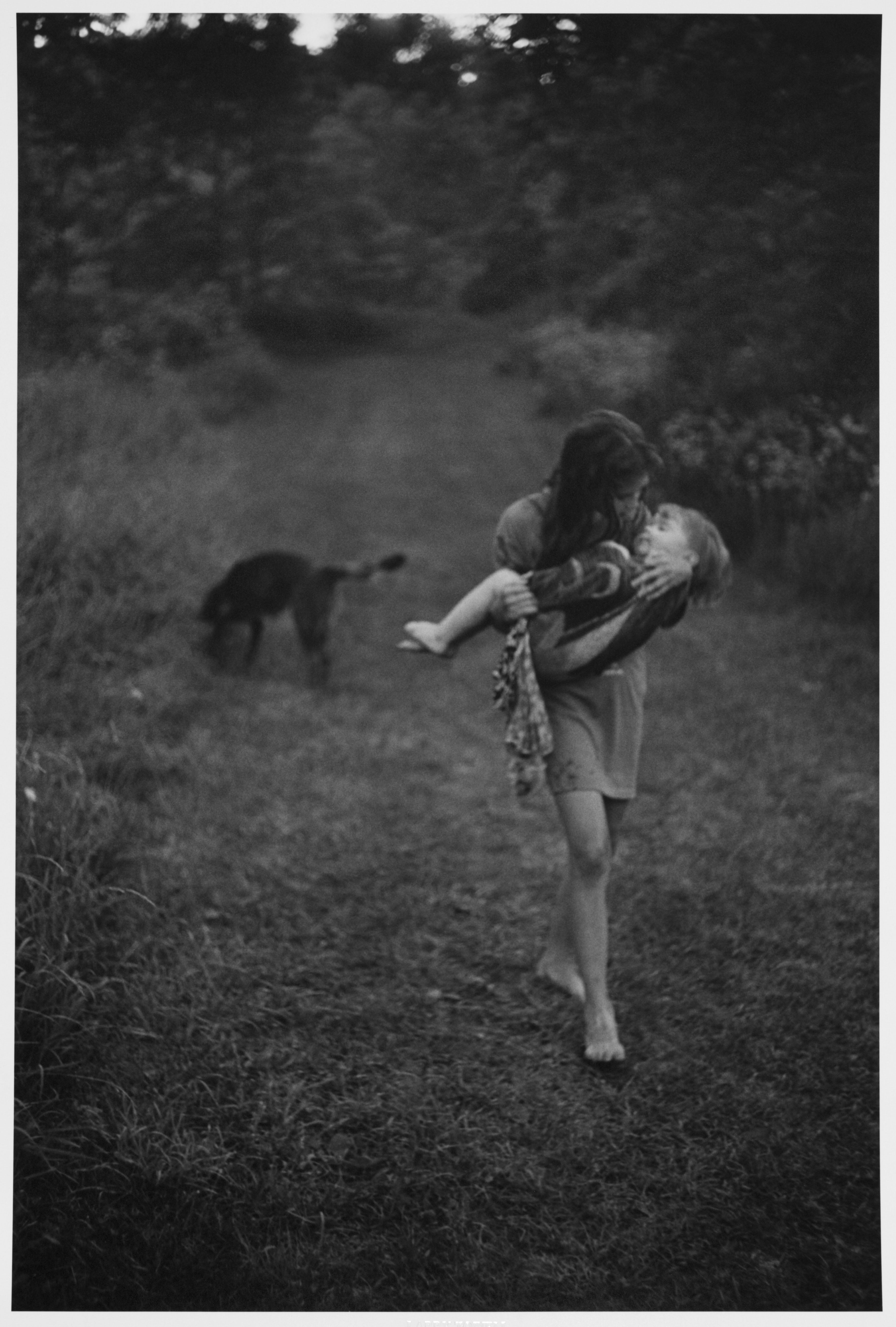 Fine Print: Naomi Towell carries her two-year-old brother home after swimming with him in the river rapids. Lambton County, Ontario, Canada, 1996