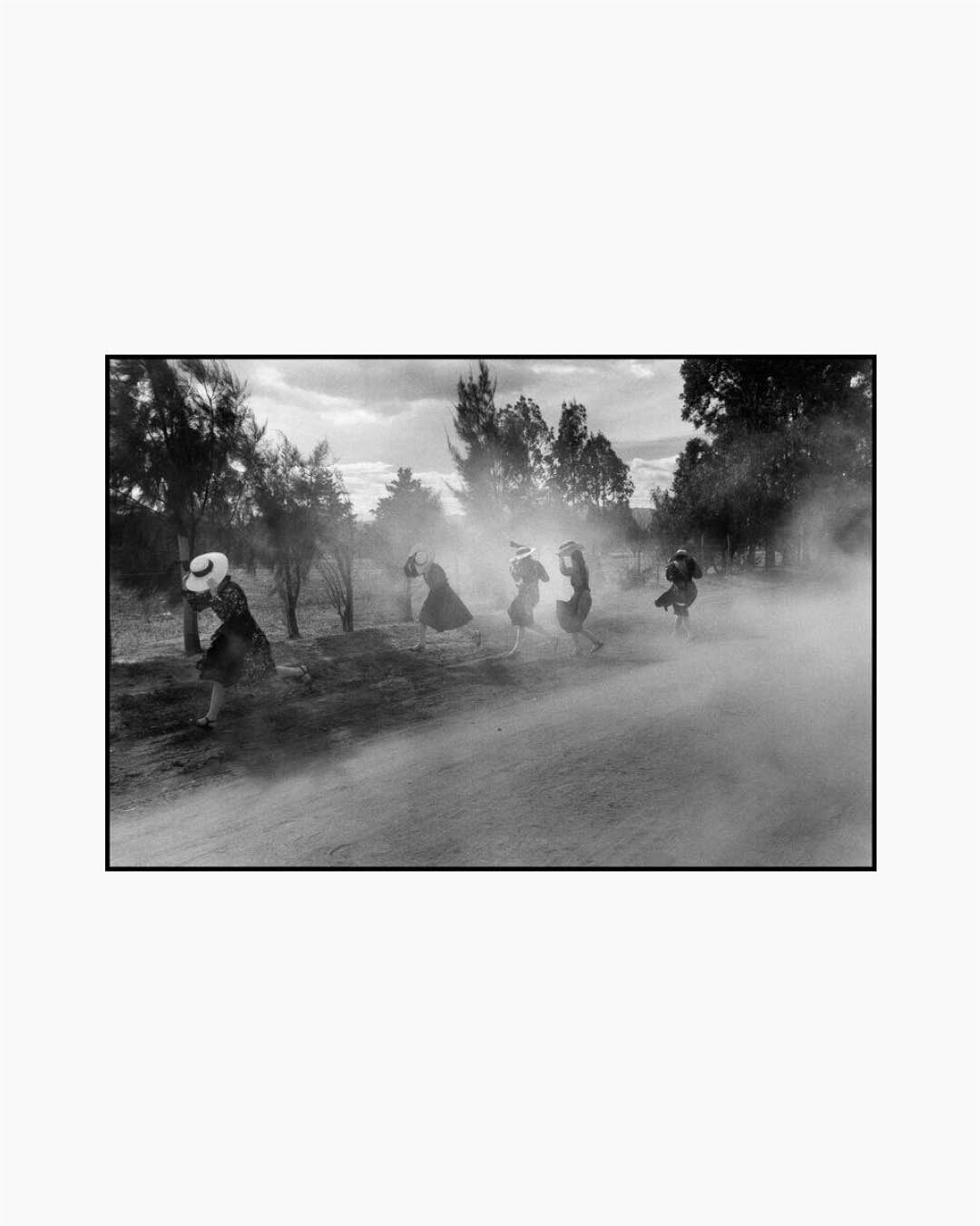 Fine Print: Young Mennonite women fleeing a cloud of dust. Durango, Mexico, 1994