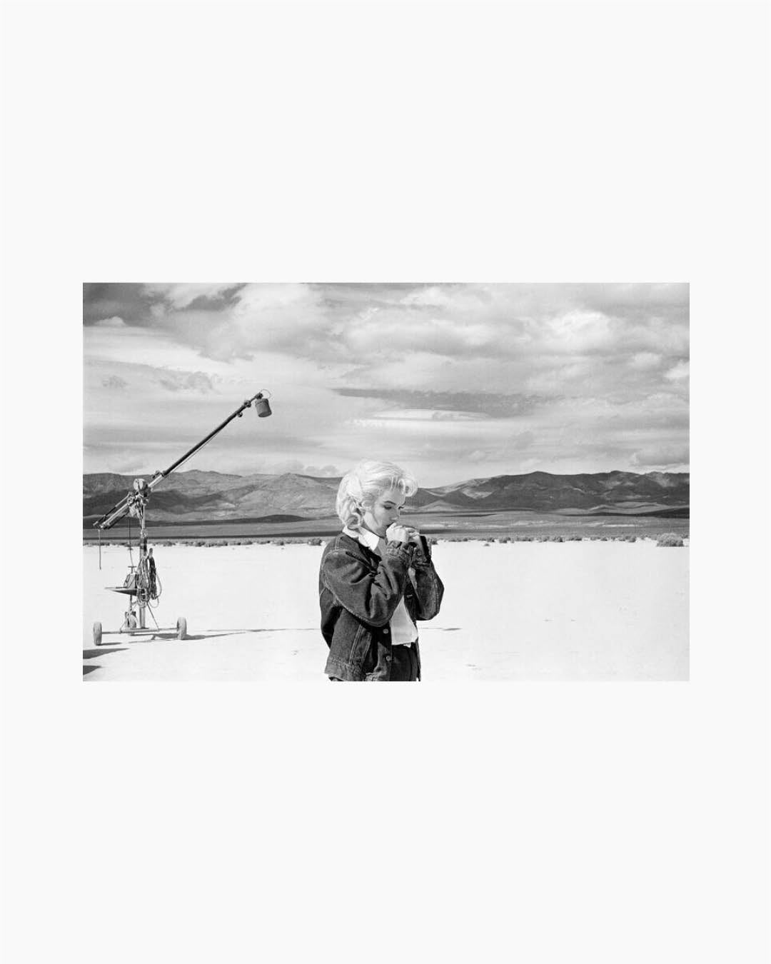 Fine Print: Marilyn Monroe on the Nevada desert going over her lines in the film 'the Misfits'. Nevada, USA, 1960
